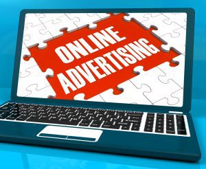 Online Advertising On Laptop Shows Websites Promotions And Ecommerce Strategies